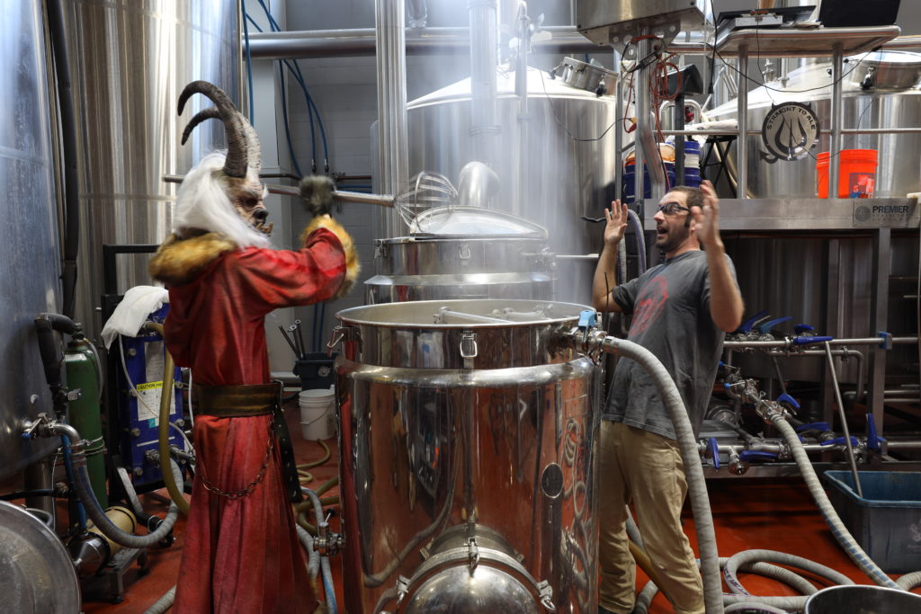 Krampus brewing a beer for Das Stahl Bierhaus